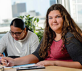 two teens studying