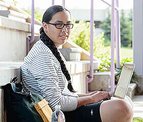 young girl using laptop