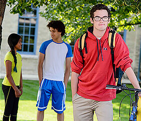 teen holding bike